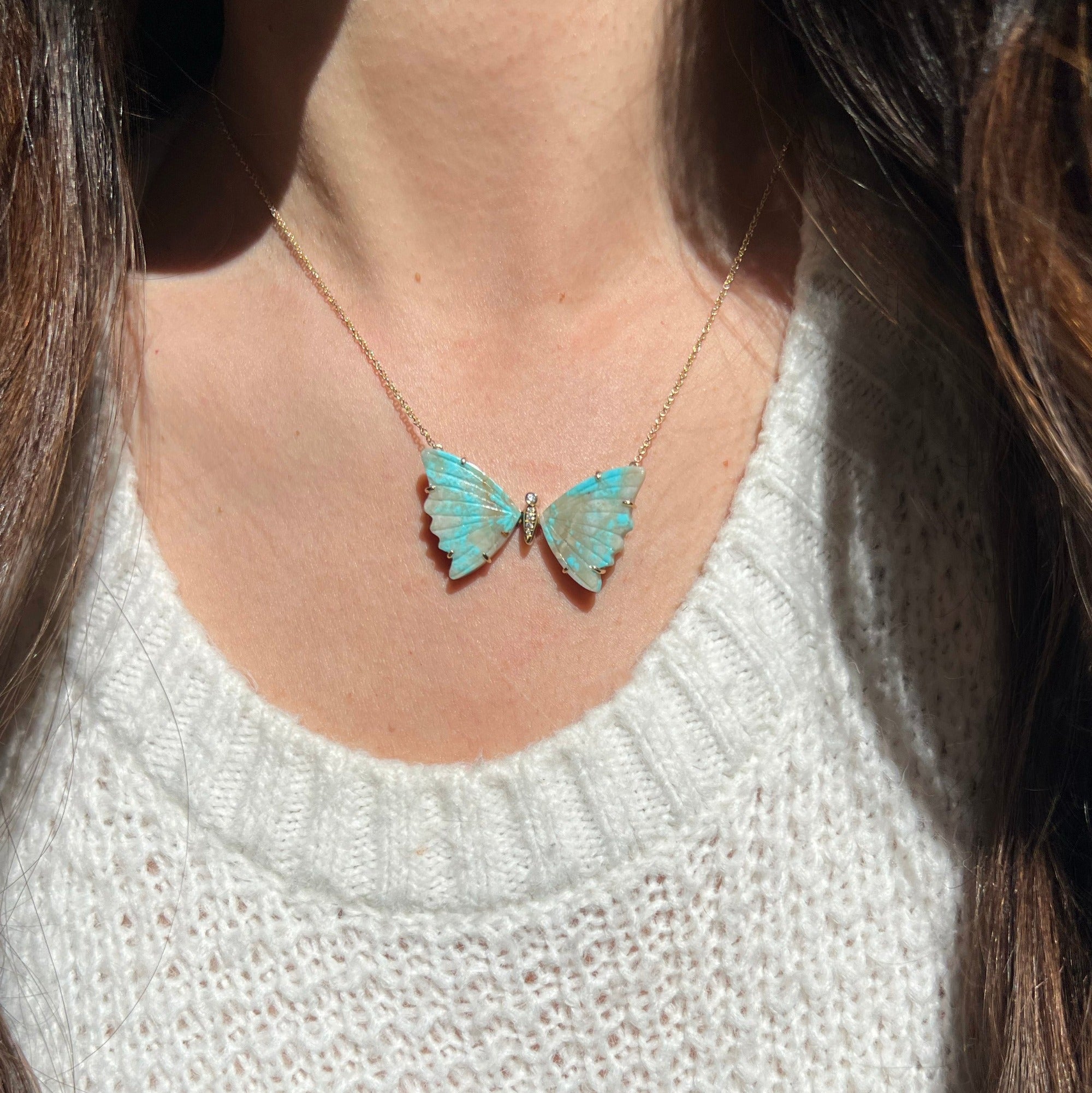 turquoise and tan butterfly necklace with prongs