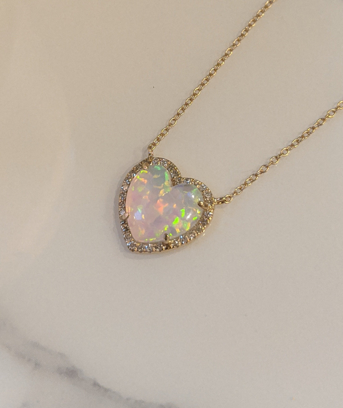 Opal Heart Diamond Necklace on Marble