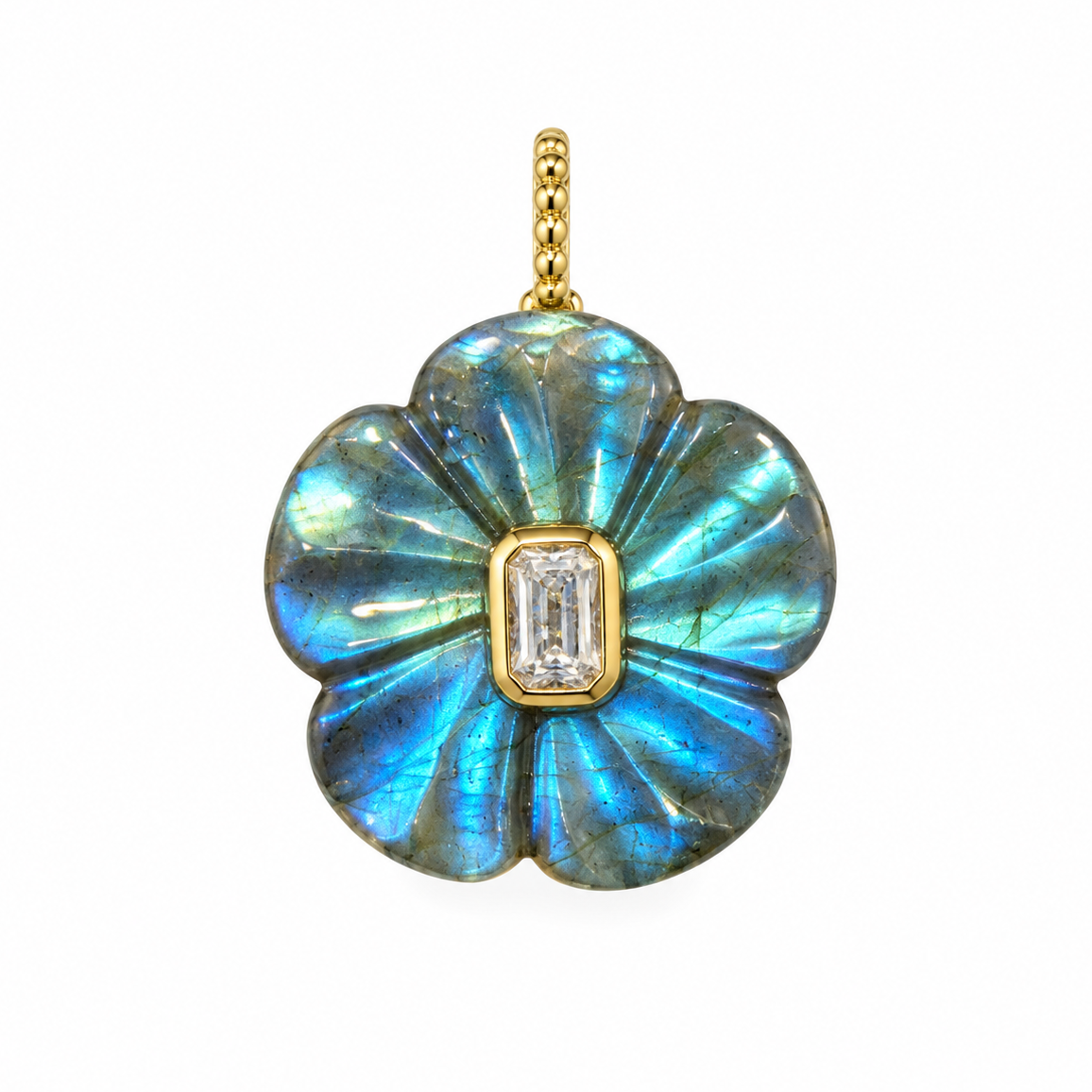 A gold flower-shaped pendant featuring iridescent blue labradorite inlay and a rectangular clear baguette gemstone in the center, suspended on a white background.
