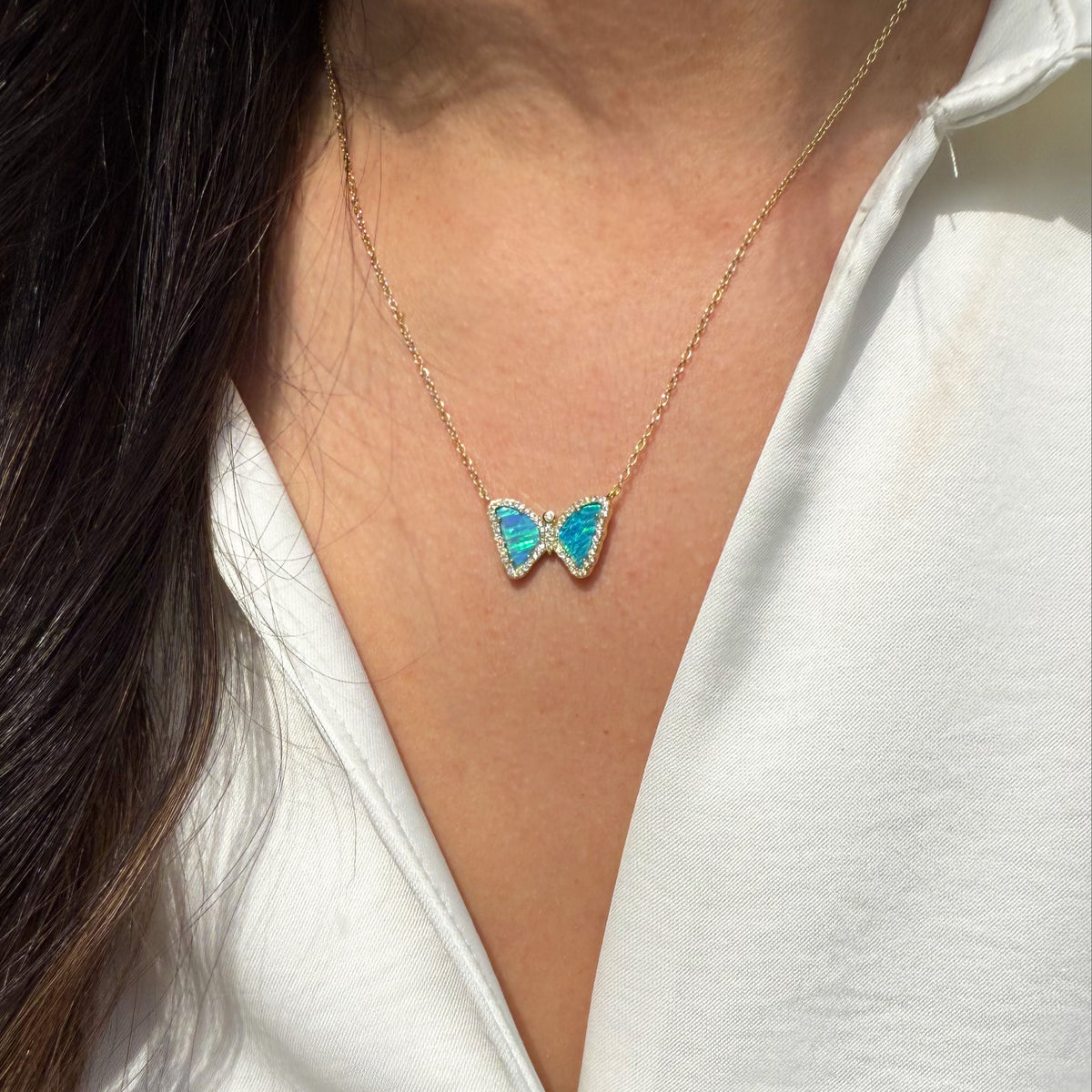Mini butterfly necklace with opal in indigo opal gold