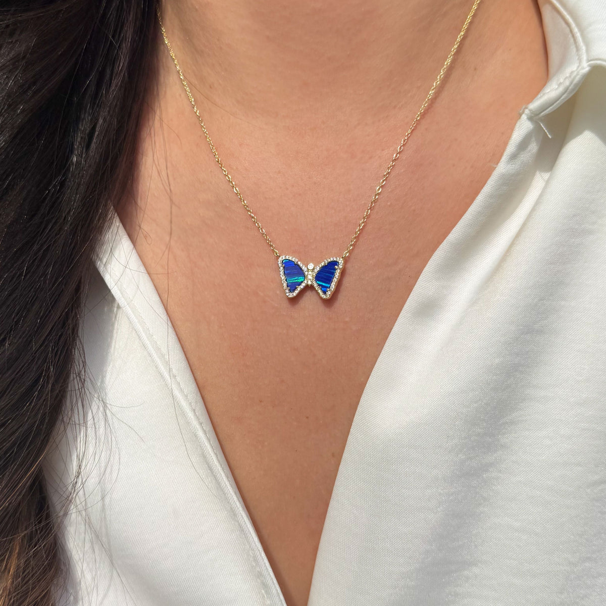 Mini butterfly necklace with opal in indigo opal gold
