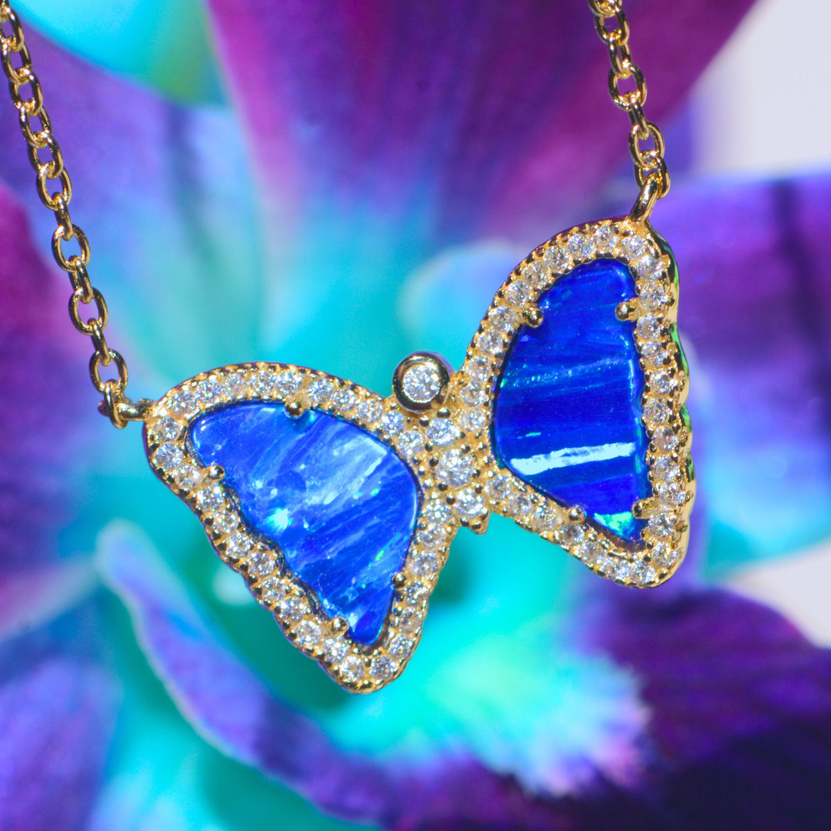 Mini butterfly necklace with opal in indigo opal gold