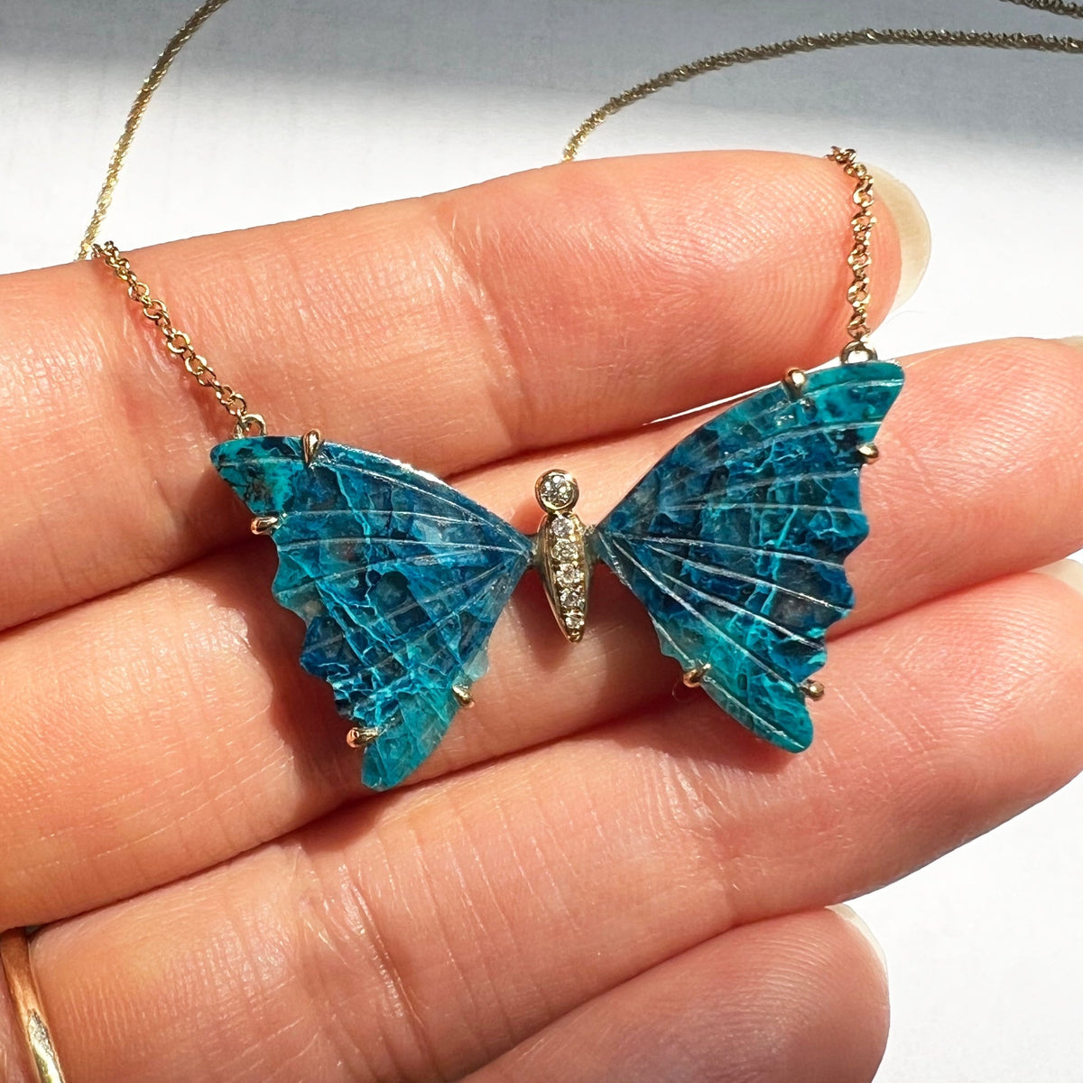 large chrysocolla butterfly necklace with prongs and diamonds