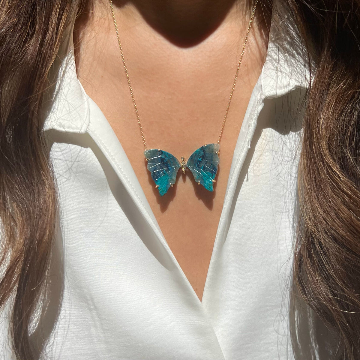 large chrysocolla butterfly necklace with prongs and diamonds lifestyle