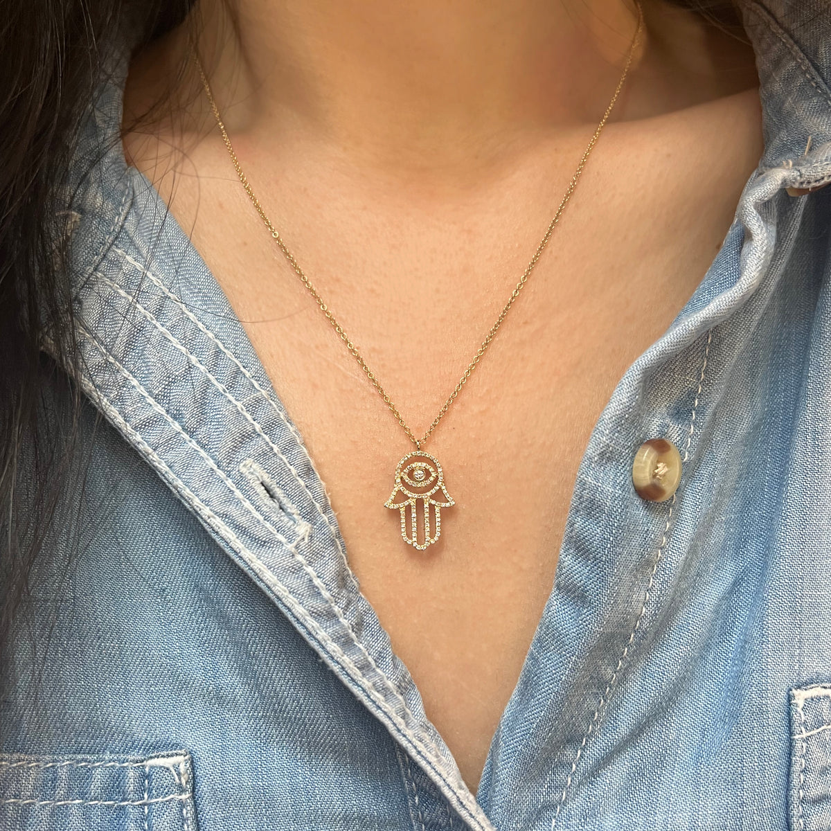 large hamsa hand with evil eye and diamonds in 14k gold