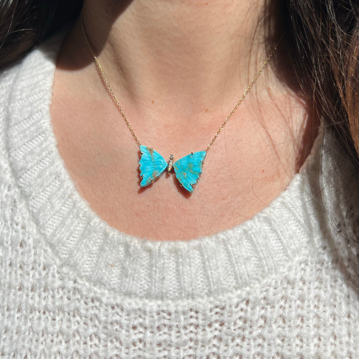 large turquoise butterfly necklace with diamonds and prongs