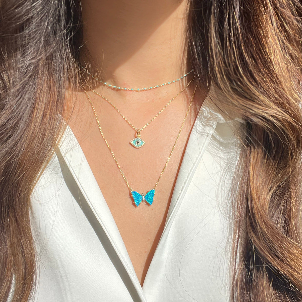 Evil Eye Enamel Charm Necklace and opal butterfly necklace with prongs