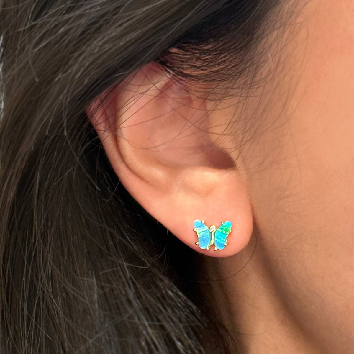 opal butterfly stud earrings blue green lifestyle