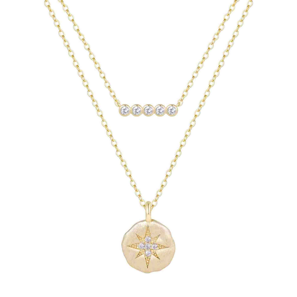 Gold necklace with star pendant and small round pendant on a white background