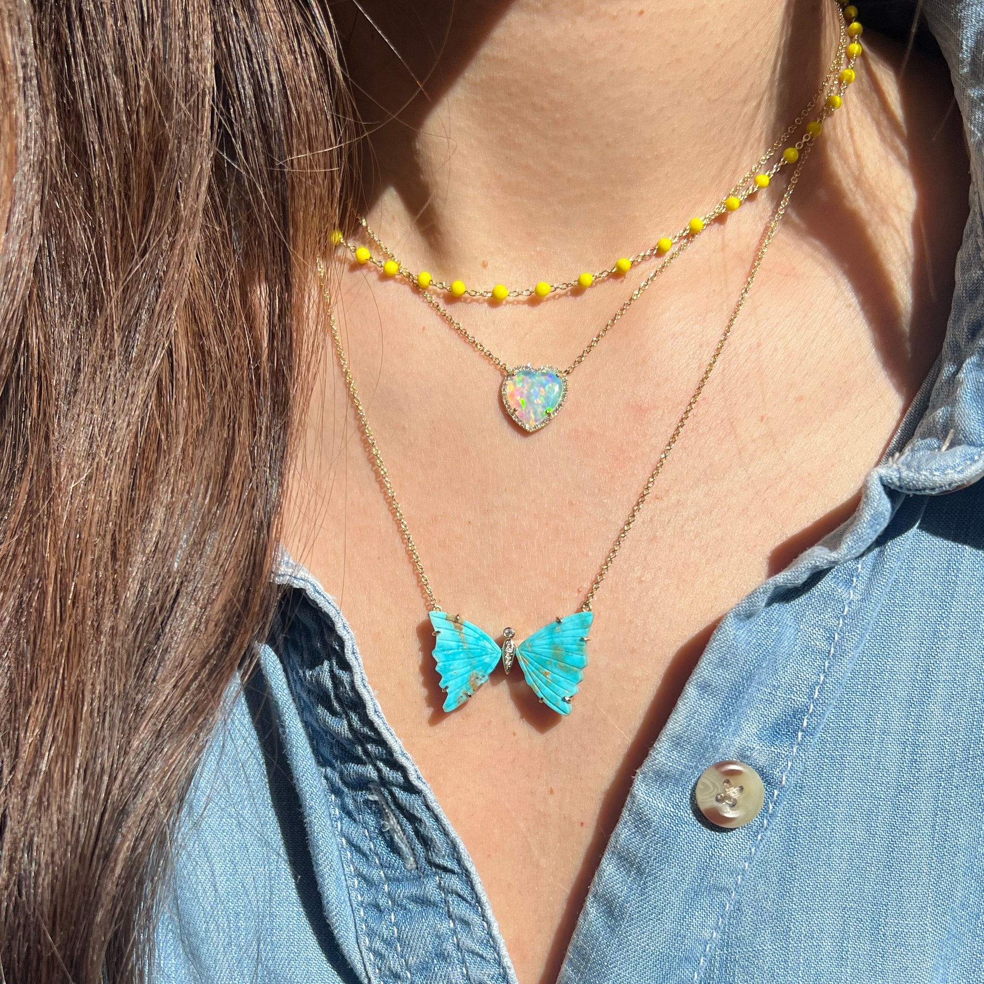 large turquoise butterfly necklace with diamonds and prongs