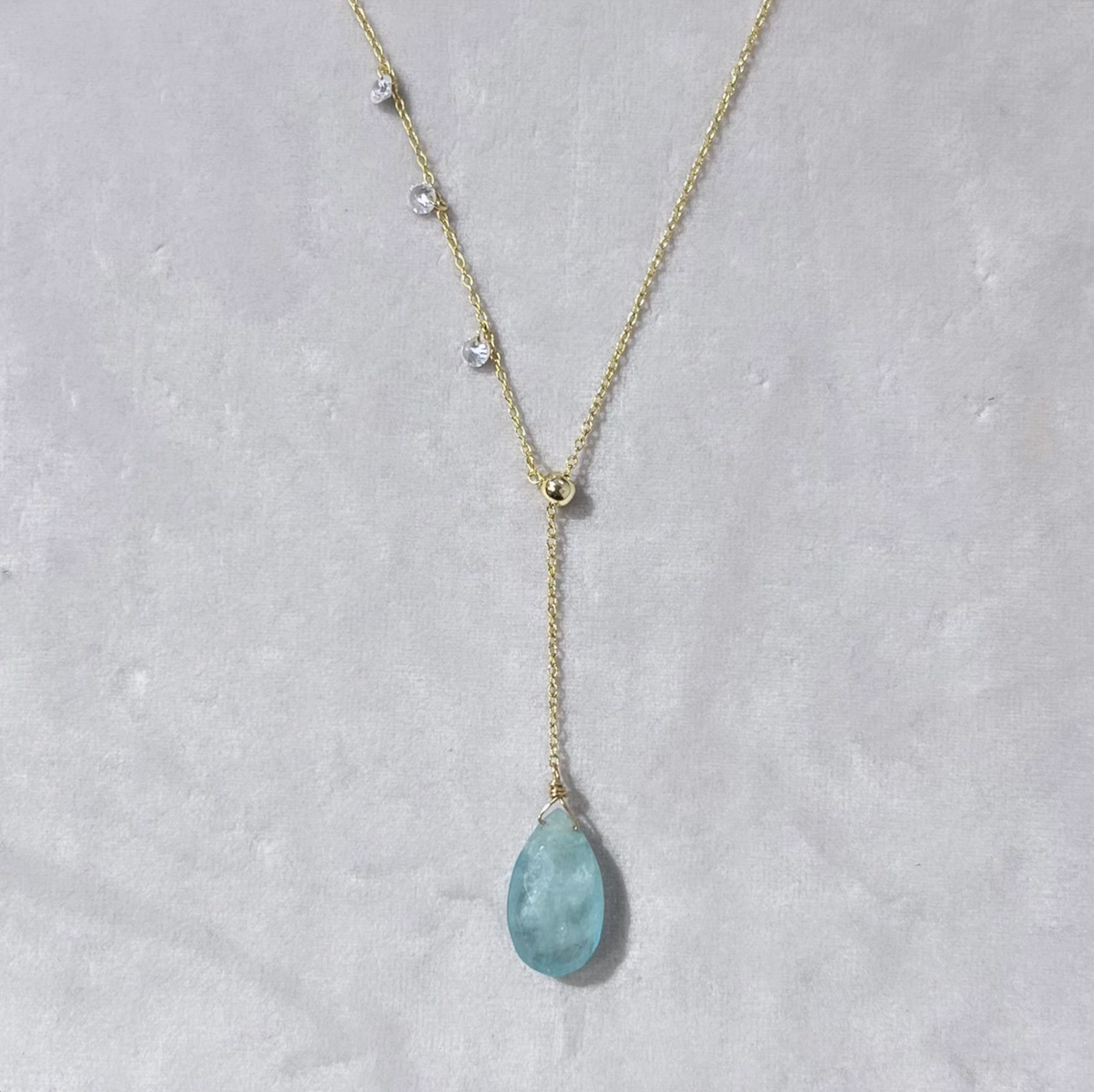 double slider lariat with aquamarine briolette drop