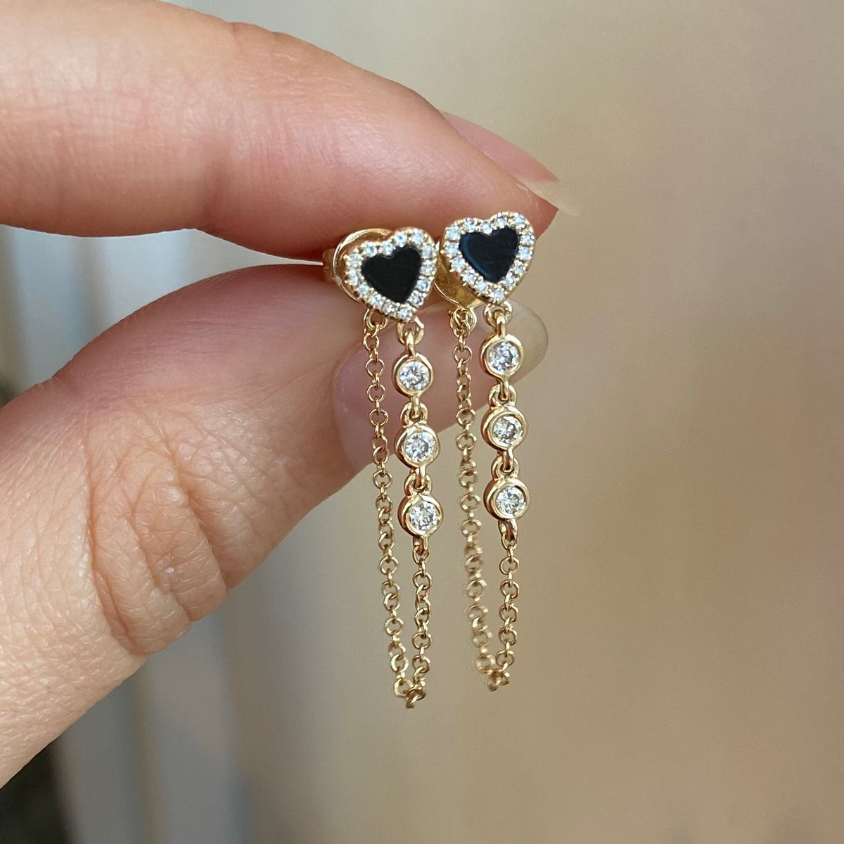 black onyx heart earrings with chain and diamonds