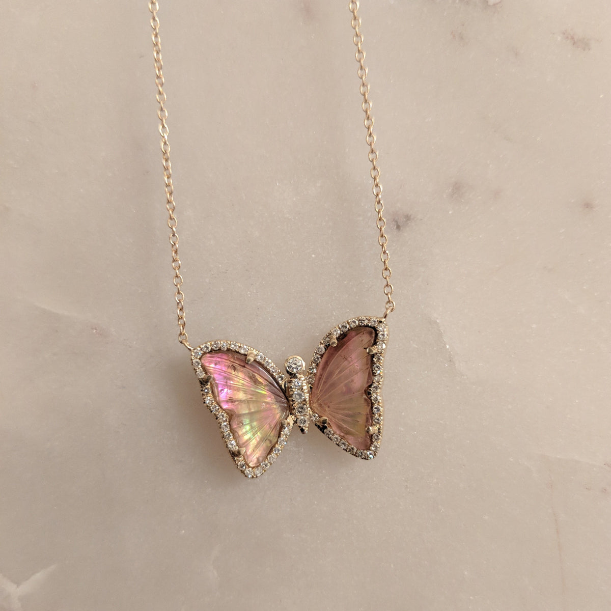 Butterfly Necklace With Pink Tourmaline and Pearl Lifestyle on Marble