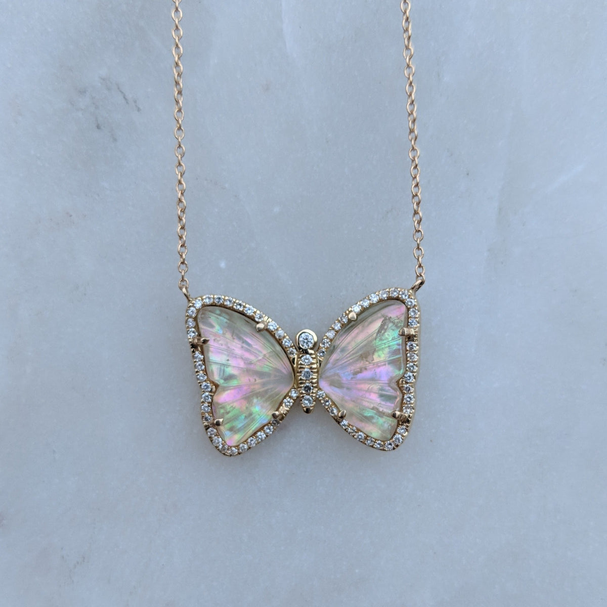 Butterfly Necklace With Tourmaline and Pearl on Marble