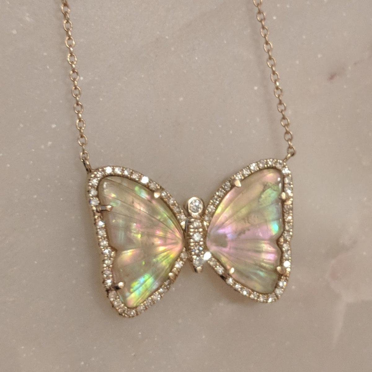 Butterfly Necklace With Tourmaline and Pearl on Marble 2