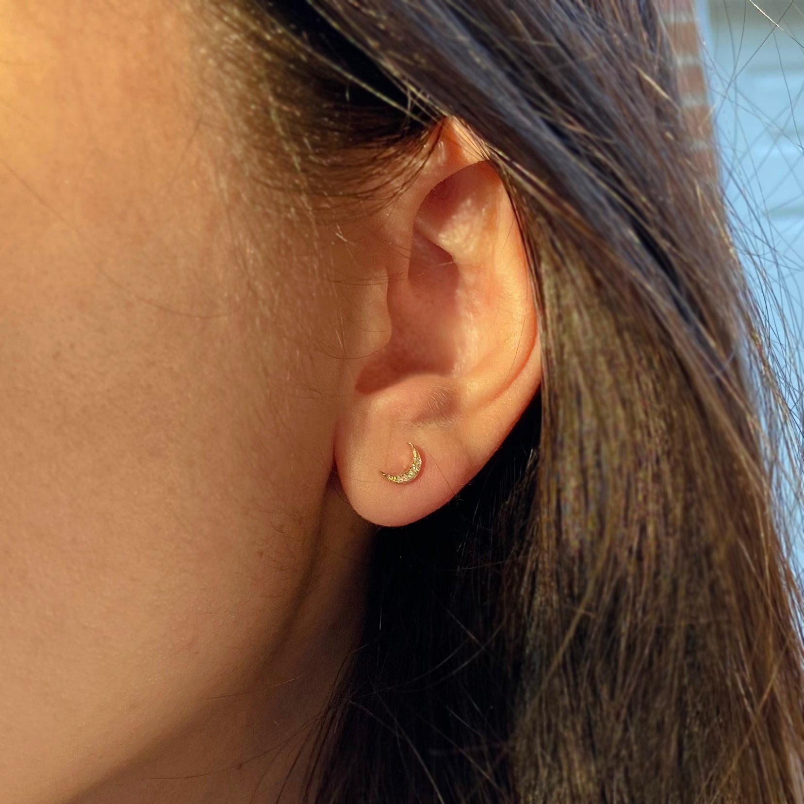 Crescent moon diamond stud earrings in 14k gold