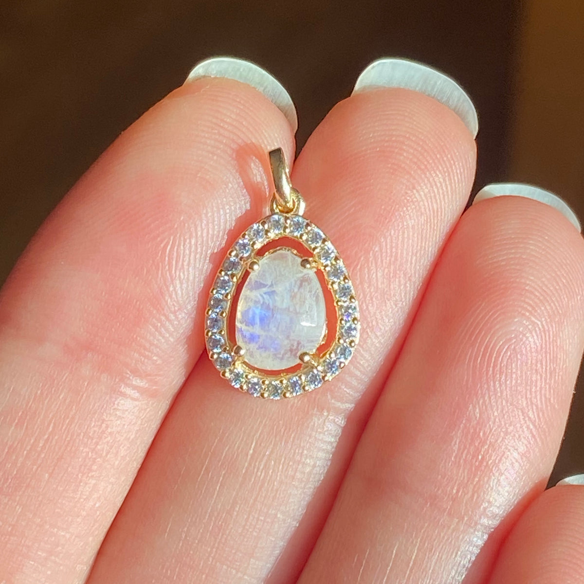 deanna rainbow moonstone pendant in hand