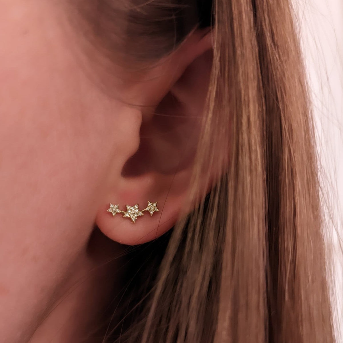 triple star stud earrings diamonds lifestyle