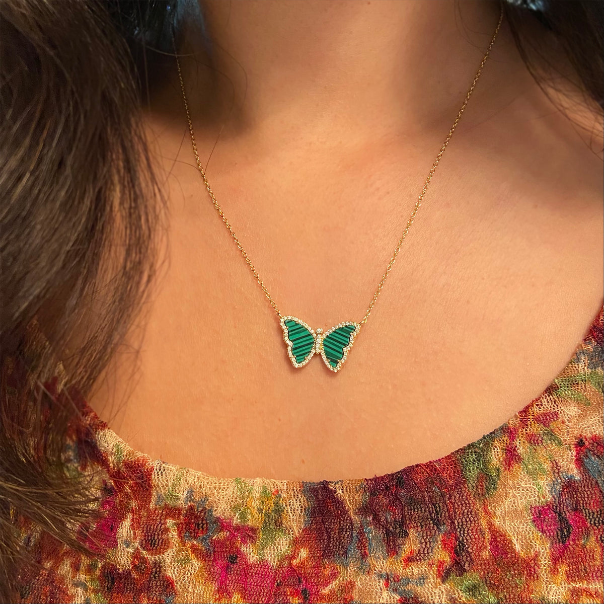 malachite butterfly necklace with crystals in gold on model