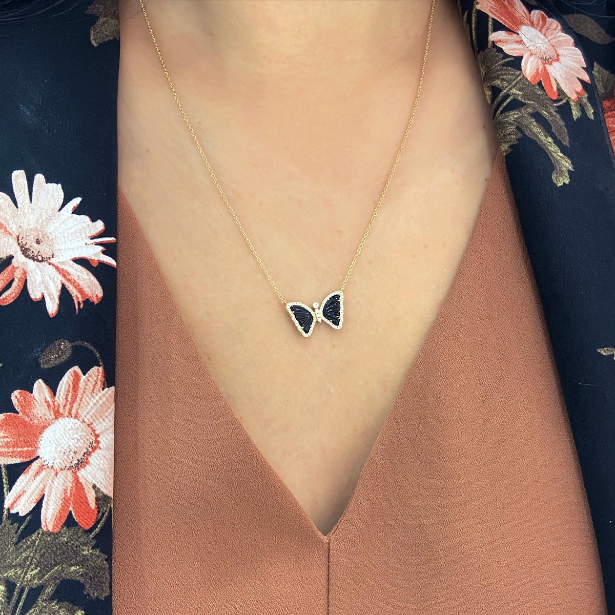 mini butterfly necklace with diamonds in black onyx lifestyle