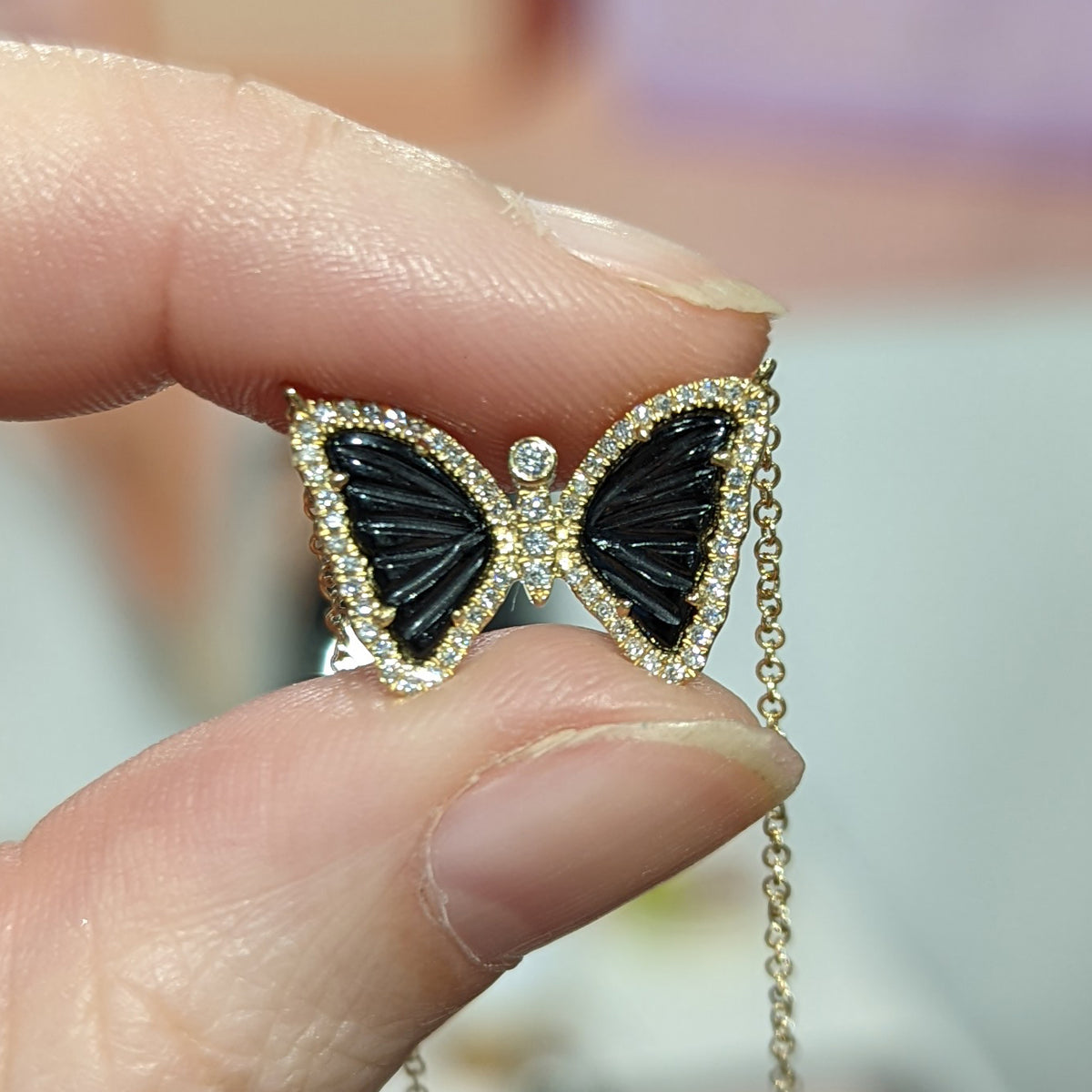mini butterfly necklace with diamonds in black onyx