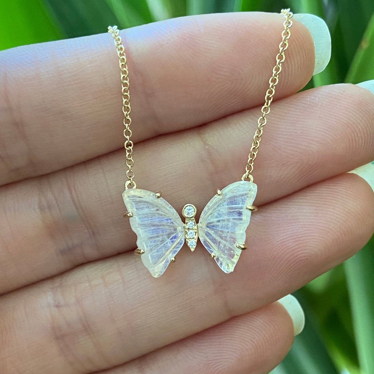 moonstone butterfly necklace with prongs and diamonds