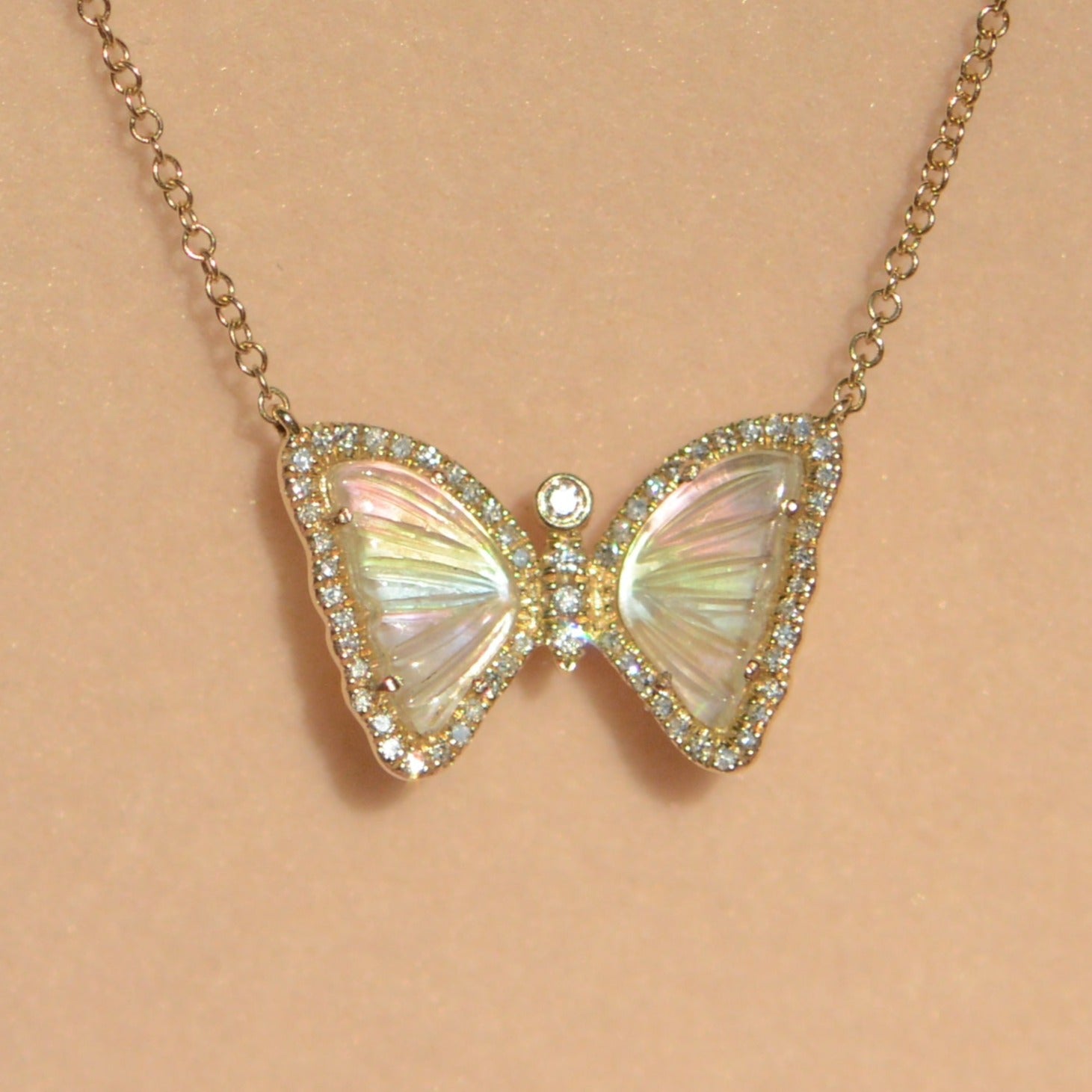 mini butterfly necklace with diamonds in rainbow pearl