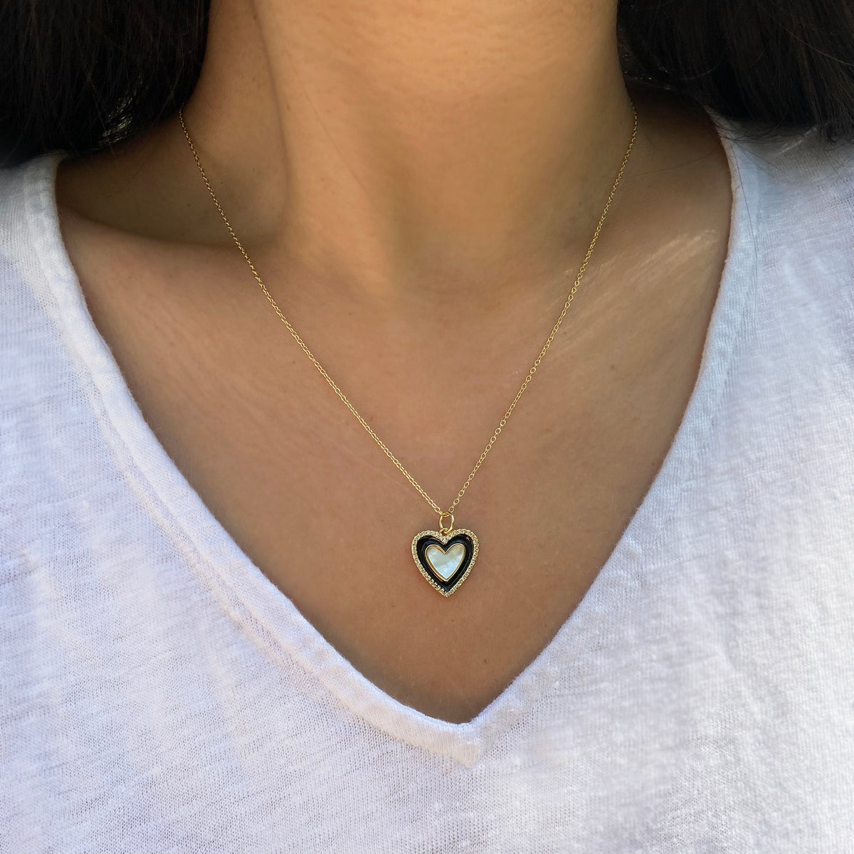 Two Toned heart necklace with black enamel and mother of pearl